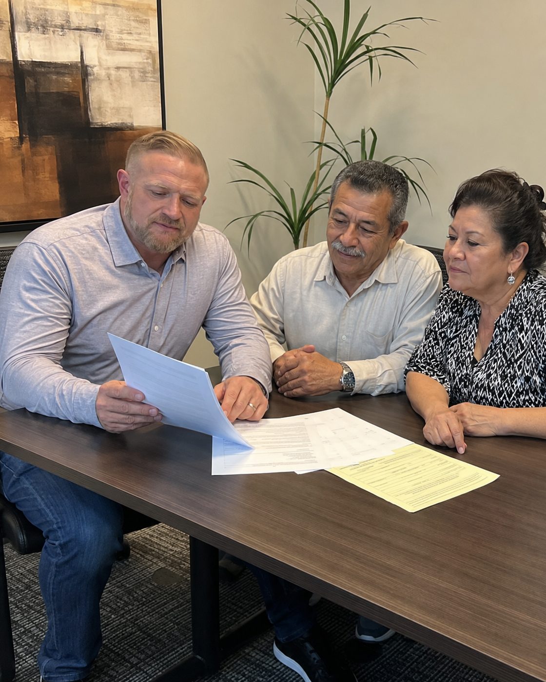 An advisor and an owner reviewing timeshare paperwork together