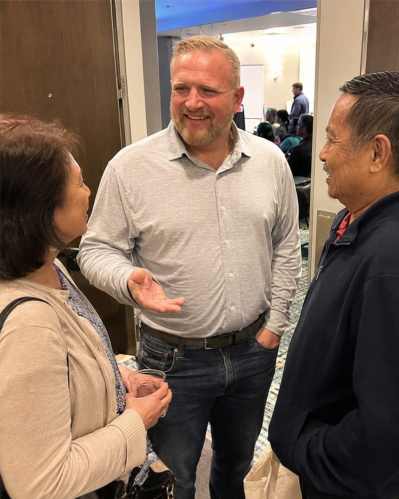 A team member answering owners' questions at a seminar